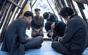 Noord-Koreaanse christenen in gebed. beeld SDOK