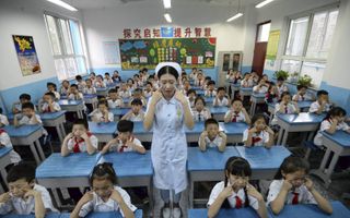 Op school moeten Chinese kinderen hard werken. beeld AFP