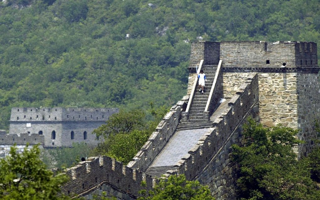 „Deze mensen in Chinese bergdorpen hebben geen auto, radio, krant of computer. Maar wanneer ben je pas echt arm? Juist ja, als je nog nooit van God gehoord hebt.” Foto EPA