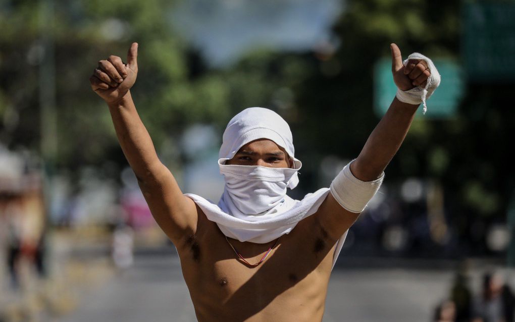 Demonstrant in Caracas. beeld EPA