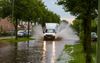 Hevige regen- en onweersbuien zorgden eerder deze maand voor ondergelopen straten, zoals hier in Voorthuizen. beeld ANP, Luciano de Graaf