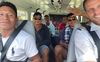 Joop van Weele (rechtsvoor op de foto) met in het vliegtuig deelnemers van de Bijbelschool in Suriname. beeld Joop van Weele