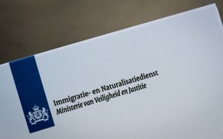 Het logo van de Immigratie- en Naturalisatiedienst (IND). beeld ANP, Lex van Lieshout