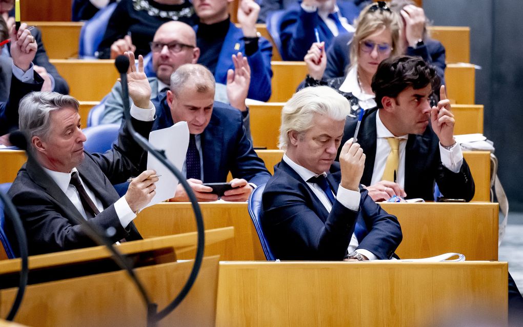 Geert Wilders en leden van de PVV-fractie tijdens stemmingen in de Tweede Kamer. ANP Robin Utrecht 