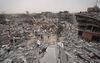 „Er zijn al veel te veel doden en gewonden te betreuren. De verwoestingen zijn enorm. Ruim 30.000 doden en meer dan 75.000 gewonden; bijna twee miljoen vluchtelingen en een gebied waar meer dan de helft van de gebouwen is verwoest; dat zijn de duizelingwekkende cijfers van het drama dat zich in Gaza voltrekt.” Foto: Palestijnen te midden van de ruïnes van Nuseirat. beeld AFP