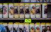 Kaarsjes te koop in het Franse bedevaartsoord Lourdes. beeld AFP, Ed Jones