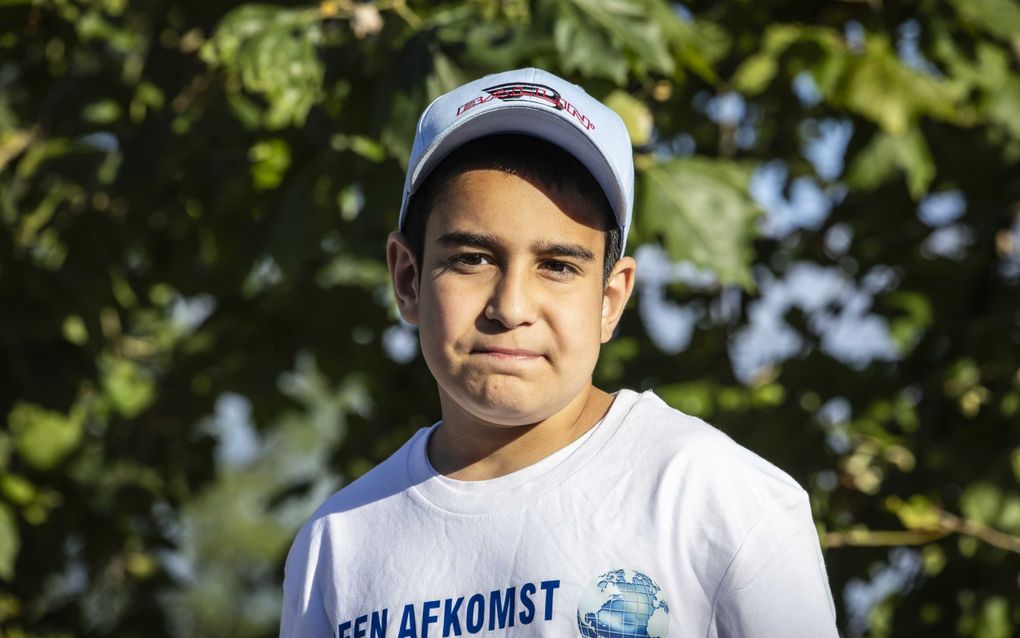 Mikael woensdag tijdens een steunbetuiging van zo’n vierhonderd mensen in zijn woonplaats Amsterdam. beeld ANP, Dingena Mol