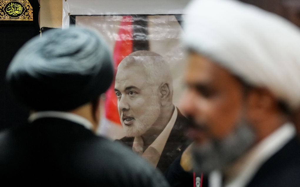 Iraqi and Iranian clerics and officials hold a vigil at office of the representative of Iran's supreme leader in Iraq's Shiite holy city of Najaf, following the death of Hamas leader Ismail Haniyeh (portrait) and victims of strikes in Lebanon and Iraq, on August 1, 2024. Iran held a funeral ceremony with calls for revenge after the killing in Tehran of Hamas political chief Ismail Haniyeh in a strike blamed on Israel.
Qassem al-KAABI / AFP