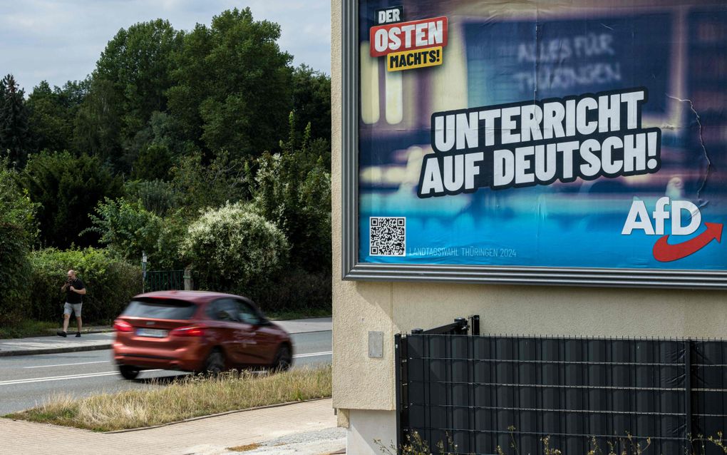 Verkiezingsposter voor de radicaal-rechtse partij Alternative für Deutschland (AfD) in de Oost-Duitse deelstaat Thüringen. Op 1 september vinden hier verkiezingen plaats. beeld AFP, Jens Schlüter