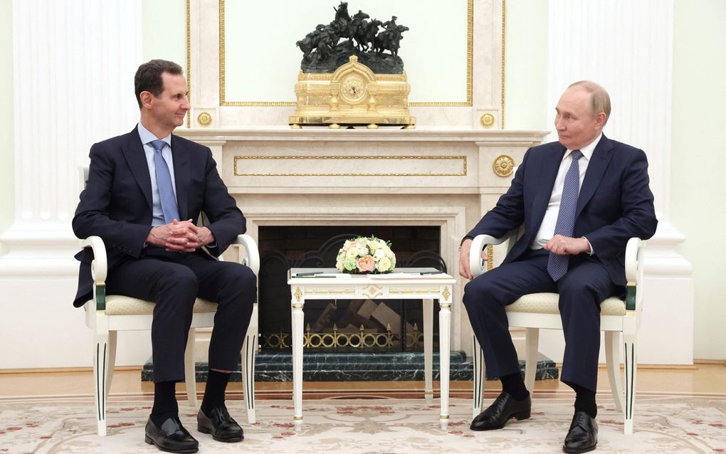 De Syrische president Bashar al-Assad (l.) en zijn Russische ambtgenoot Vladimir Poetin tijdens een ontmoeting in Moskou in juli dit jaar. beeld AFP, Valery Sharifulin