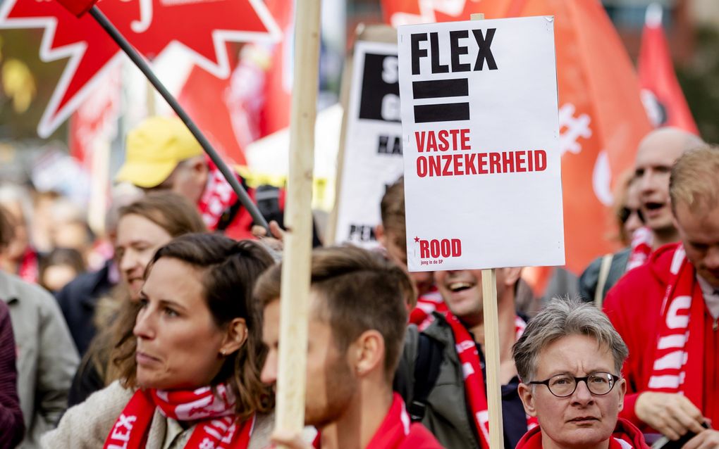 Flexwerkers roepen op tot meer zekerheid tijdens de Mars voor Zekerheid in 2018. beeld ANP, Robin van Lonkhuijsen