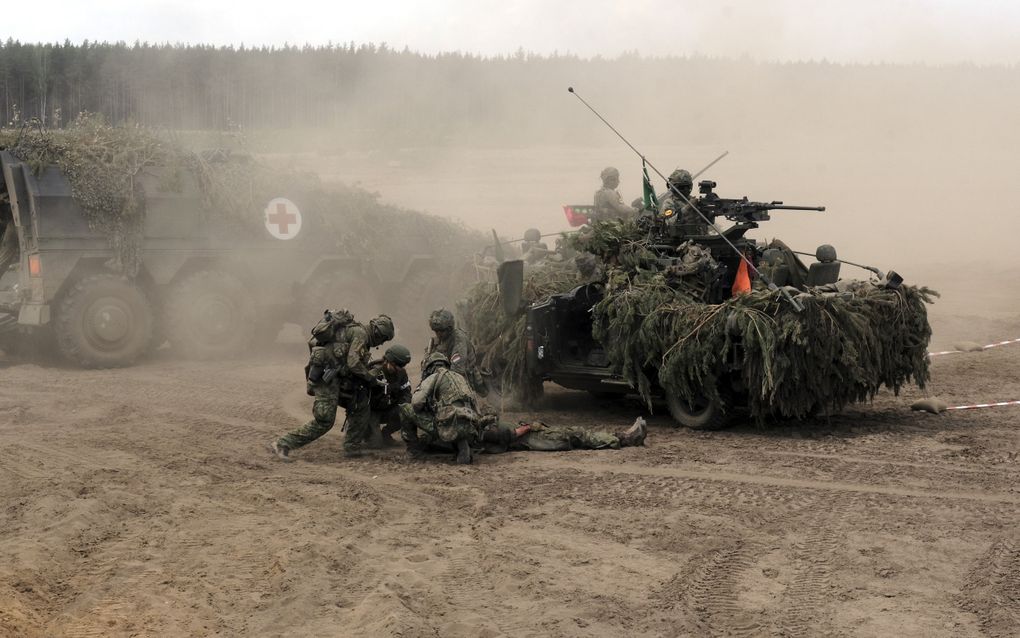 Duitse militairen in actie tijdens een NAVO-oefening ten noorden van de Litouwse hoofdstad Vilnius, eind mei. beeld EPA, Valda Kalnina