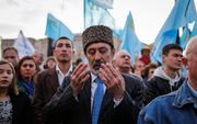 Krim-Tataren herdenken ieder jaar dat ze door Sovjetdictator Jozef Stalin in 1944 van de Krim werden gedeporteerd. Op de foto de herdenking van 2015 in de Oekraïense hoofdstad Kyiv. beeld EPA, Roman Pilipey