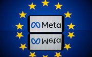 Het logo van Meta en de twaalf gouden sterren van de Europese vlag. beeld AFP, Lionel Bonaventure