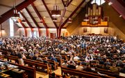 Preken tijdens de Broeder Conferentie van Oekraïense baptisten –in de Werkendamse Bethelkerk– werden afgewisseld met optredens van koor en koperblazers. beeld Cees van der Wal