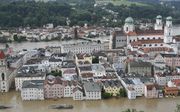 De stad van de drie rivieren noemt Passau zichzelf. Op de achtergrond de Inn, op de voorgrond de Donau. De Ilz, die ongeveer op deze plek de Donau in stroomt, is net niet te zien. beeld AFP, Michaela Stache