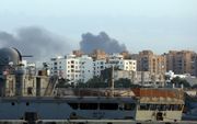 Rook stijgt op in het centrum van Tripoli. beeld AFP