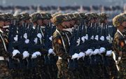 Myanmarese militairen tijdens een parade in Naypyidaw, maart 2023. beeld AFP / STR