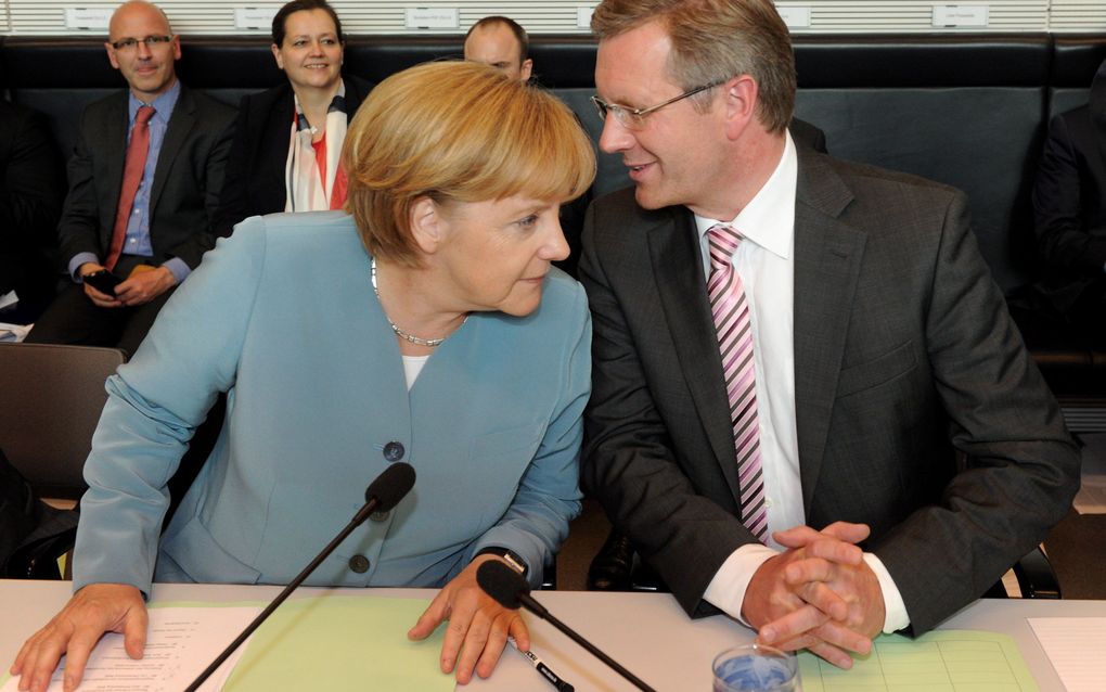 Merkel (links) en Wulff. Foto EPA