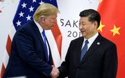 President van de VS Donald Trump en Chinese leider Xi Jinping tijdens een ontmoeting in juni dit jaar. beeld AFP