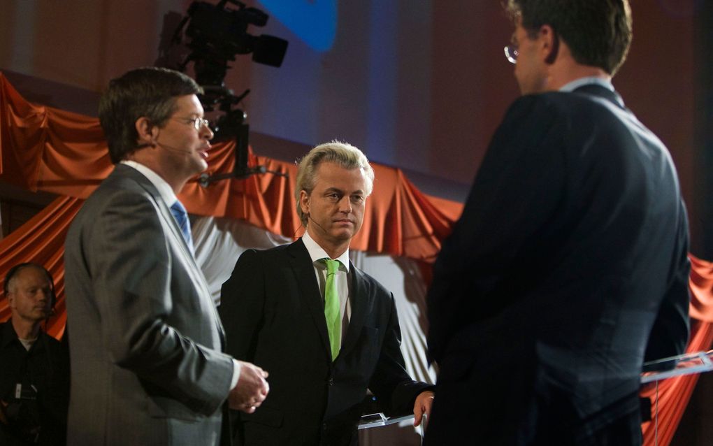 Mark Rutte (r.) in debat met Balkenende en Wilders. Foto ANP