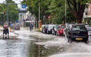 Door klimaatverandering komt extremer weer vaker voor. Een flinke onweersbui veroorzaakte deze zomer wateroverlast in Zwolle. beeld ANP, Nickelas Kok