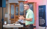 Dr. James M. Hamilton houdt een lezing over de Bijbels theologische visie op aanbidding. beeld Niek Stam