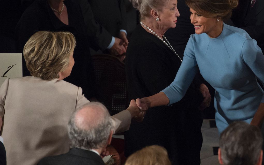 Hillary Clinton en Melania Trump. beeld AFP