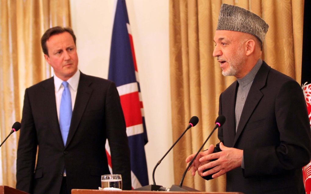 De Britse premier Cameron voerde donderdag overleg met president Karzai. Foto EPA