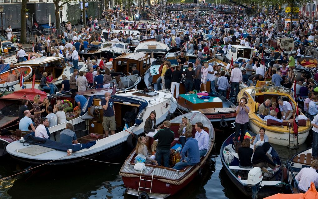 Publiek bij het Amsterdamse Grachtenfestival. Foto ANP