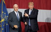 Presidentskandidaat Donald Trump met zijn running mate Mike Pence tijdens een verkiezingsbijeenkomst in 2016. De Republikein Trump versloeg dat jaar, voor velen verrassend, Hillary Clinton. beeld AFP, Tasos Katopodis