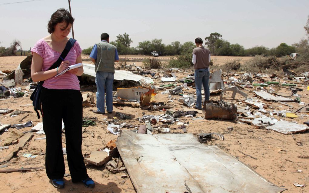 Forensisch team doet onderzoek op de rampplek in Tripoli. Foto ANP