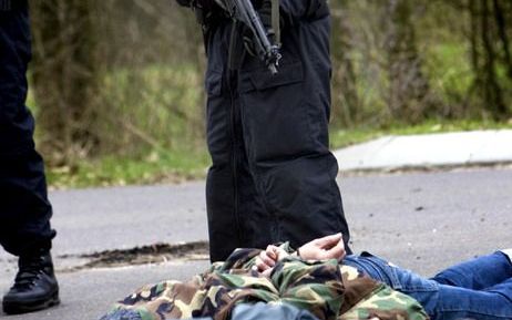 Arrestatieteams van de politie zouden hun eigen scherpschutters moeten krijgen. - Foto ANP