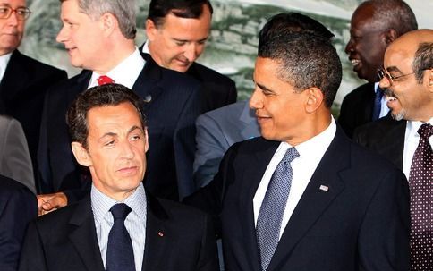 President Obama in gesprek met president Sarkozy van Frankrijk. Foto ANP