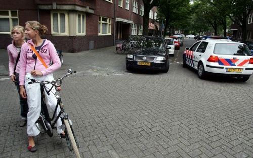 AMSTERDAM - Een politiewagen in de straat waar Melchers ontvoerd is. Foto: ANP