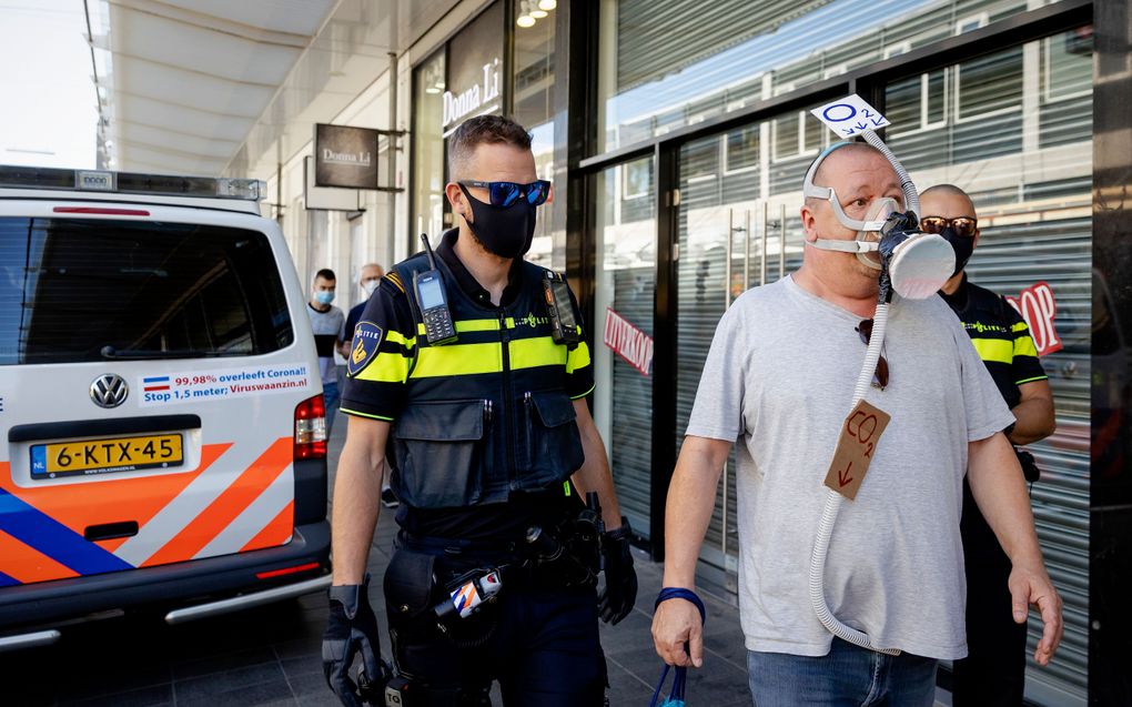 Een demonstrant tegen de mondkapjesplicht. beeld ANP