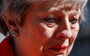 Theresa May hield het niet droog tijdens de aankondiging van haar aftreden. beeld AFP