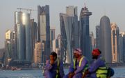 Arbeidskrachten in Doha, een aantal dagen voor de start van het wereldkampioenschap voetbal.  beeld AFP, David Gannon