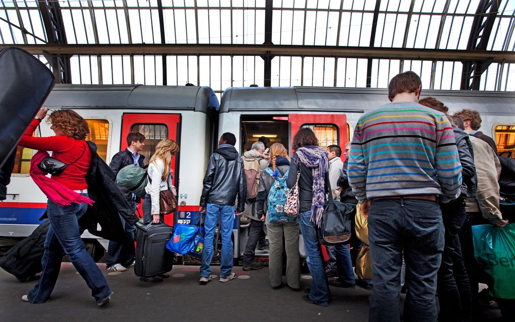 Reizigers op Amsterdam CS. Foto ANP