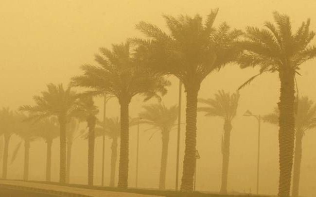 Koeweit-Stad tijdens een zandstorm. beeld AFP