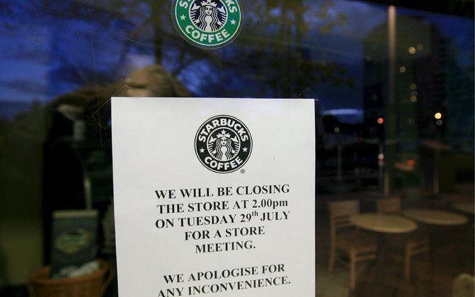 SYDNEY - Een winkel van Starbucks in Sydney. De koffieketen sluit in Australië 61 winkels. Foto EPA