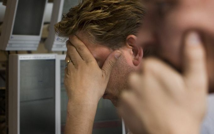 Bedenkelijke gezichten op de Amsterdamse beurs. Foto ANP