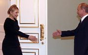 De Russische minister-president Putin en Oekraïnse collega Timoshenko werden het eerder al eens over gasleveringen. Foto EPA