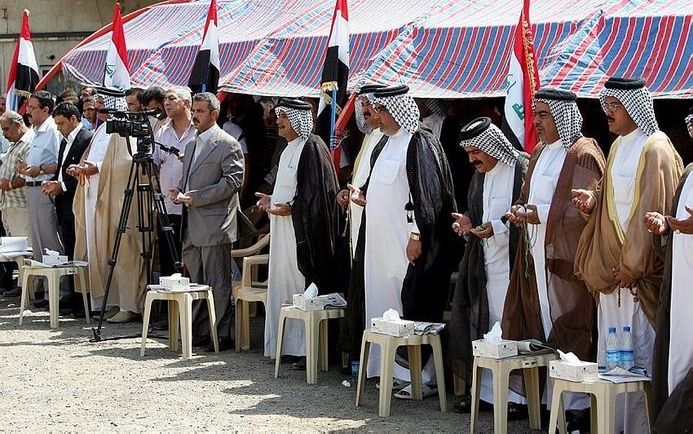 BAGHDAD - Stemleiders protesteren na recente aanslagen in Irak. - Foto EPA