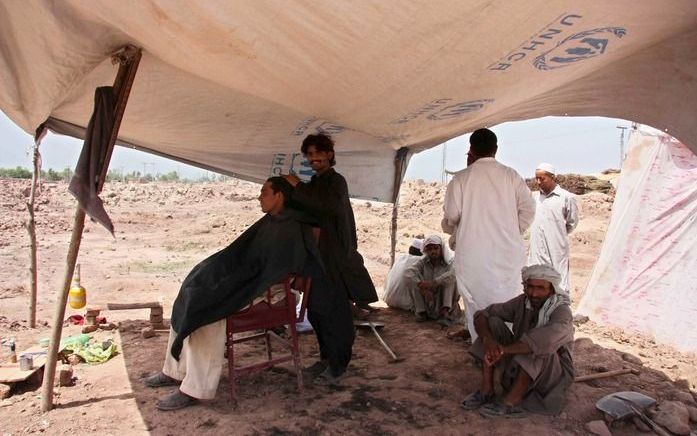 Gevluchte Pakistanen in een tentenkamp. Foto EPA