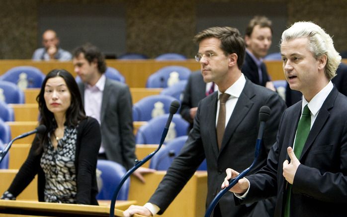 DEN HAAG - Wilders (r.), Rutte (m.) en Peter donderdag in de Tweede Kamer in Den Haag. Foto ANP