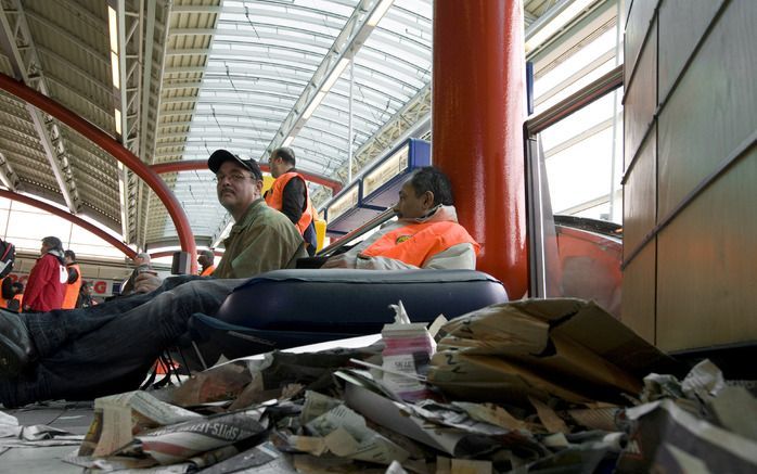 Stakende schoonmakers. Foto ANP