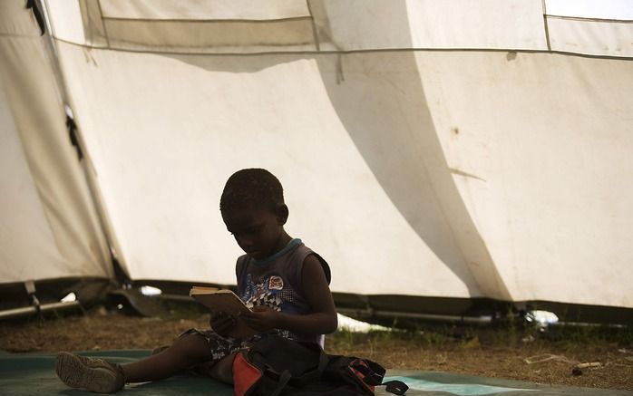 PORT–AU–PRINCE – Nederlandse hulporganisaties zijn in Haïti begonnen met de bouw van huizen voor mensen die door de aardbeving van januari dakloos zijn geworden. Foto EPA