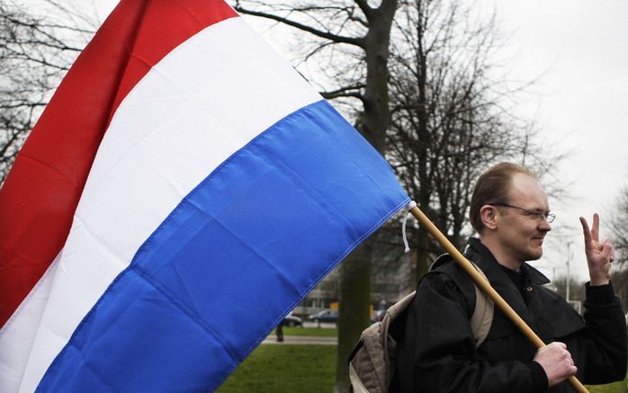 De helft van de Nederlanders heeft een Nederlandse vlag in huis. Twee derde van die mensen hangt die ook uit op Koninginnedag. Foto ANP