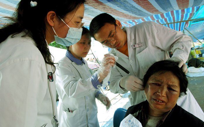 In de provindie Sichuan liggen volgens een schatting van de Chinese overheid nog meer dan 25.000 mensen onder het puin. Foto EPA